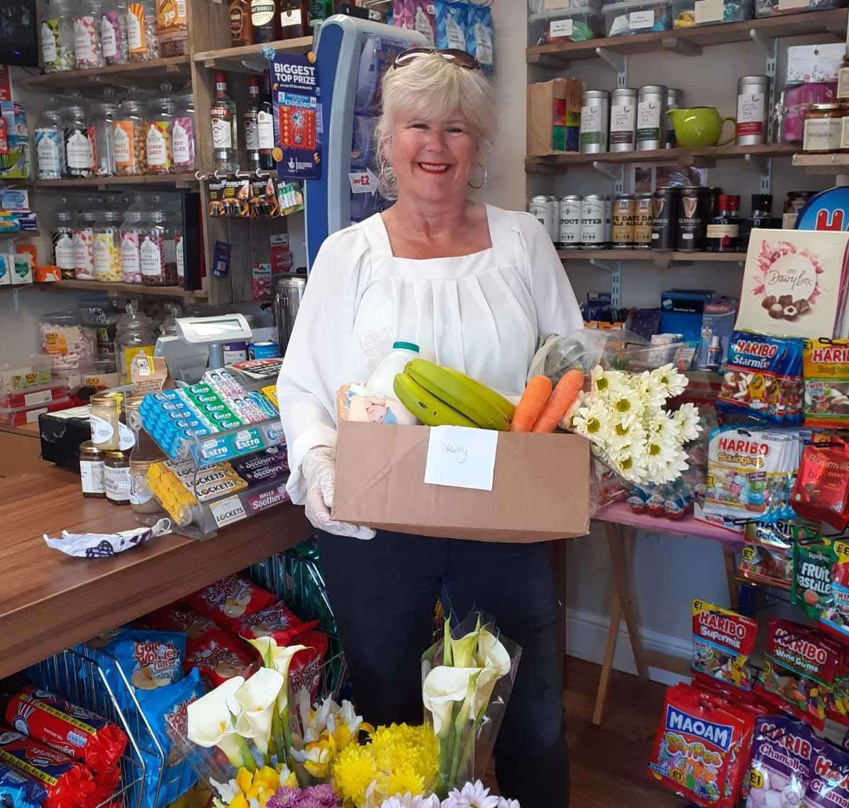 Tracy Carr with one of the boxes being prepared by Sholden Village Store
