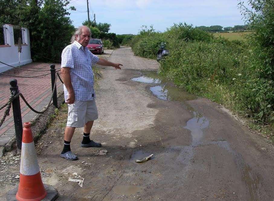 Malcolm Newell from Eastchurch by a leak which has sprung-up near his home.