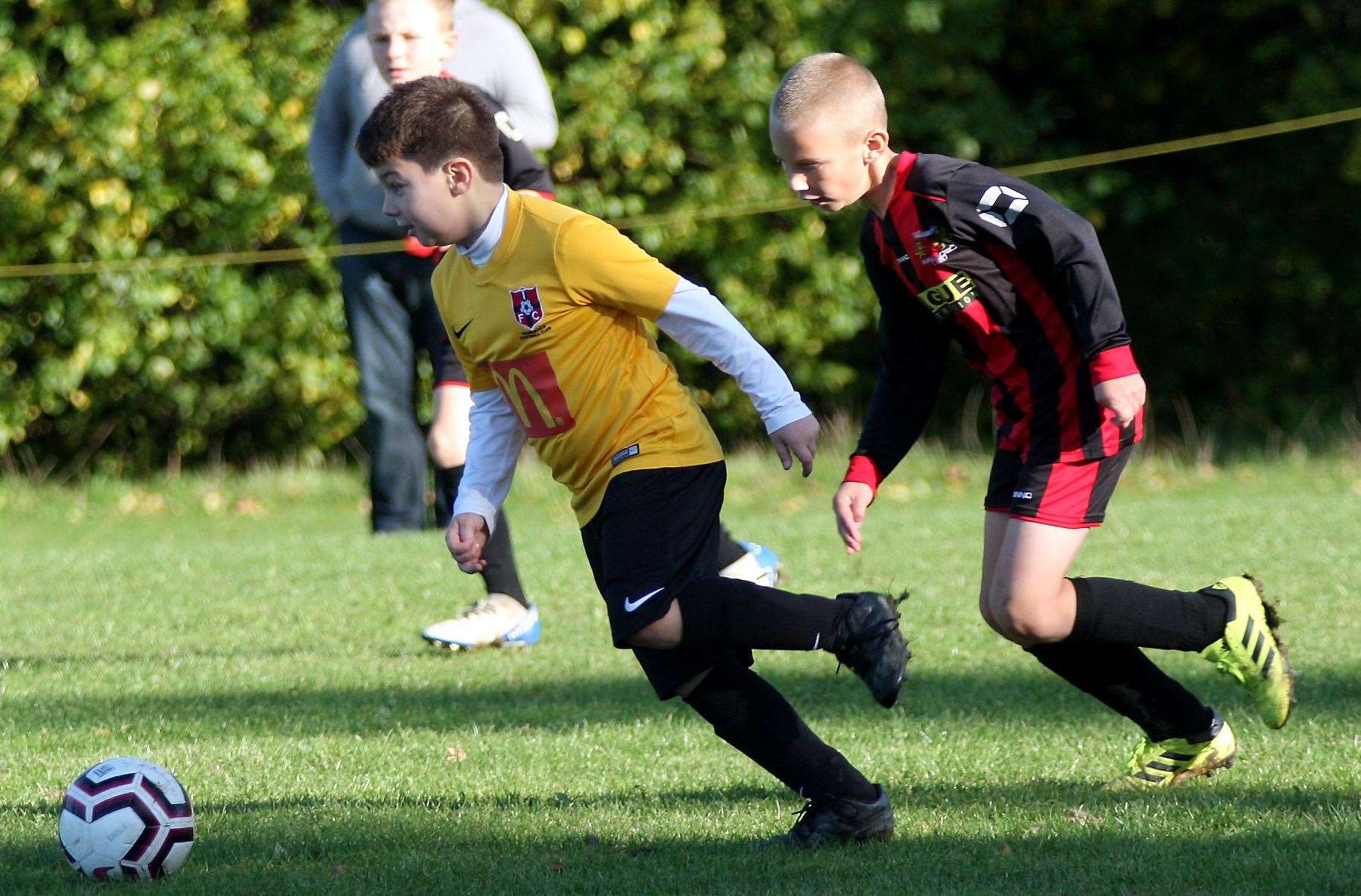 Thamesview Rangers under-9s get ahead of Woodcoombe Youth under-9s Picture: Phil Lee