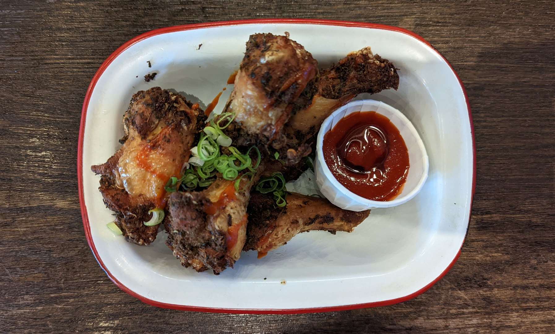 A side of honey and sriracha chicken wings