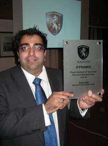 Naz Khalik of Dynamix accounting firm with plaque presented by Kent County Cricket Club in recognition of his firm's support for new sponsorship scheme