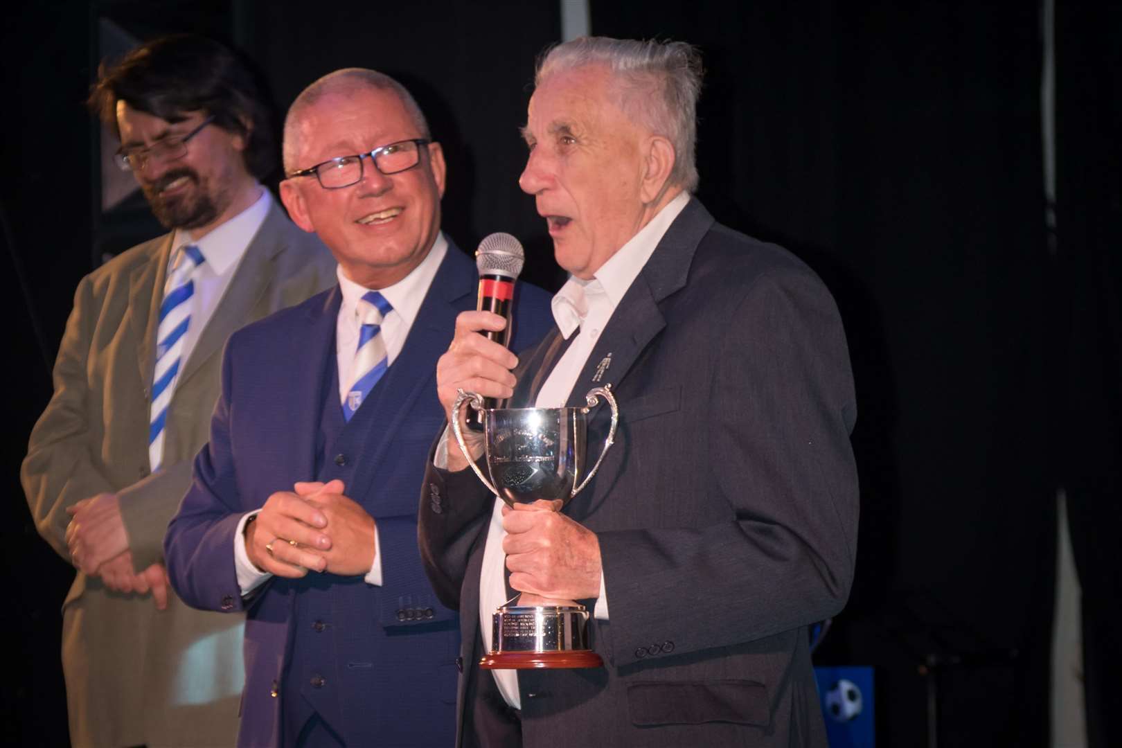 Chairman Paul Scally presents Eric Hawkins with his award