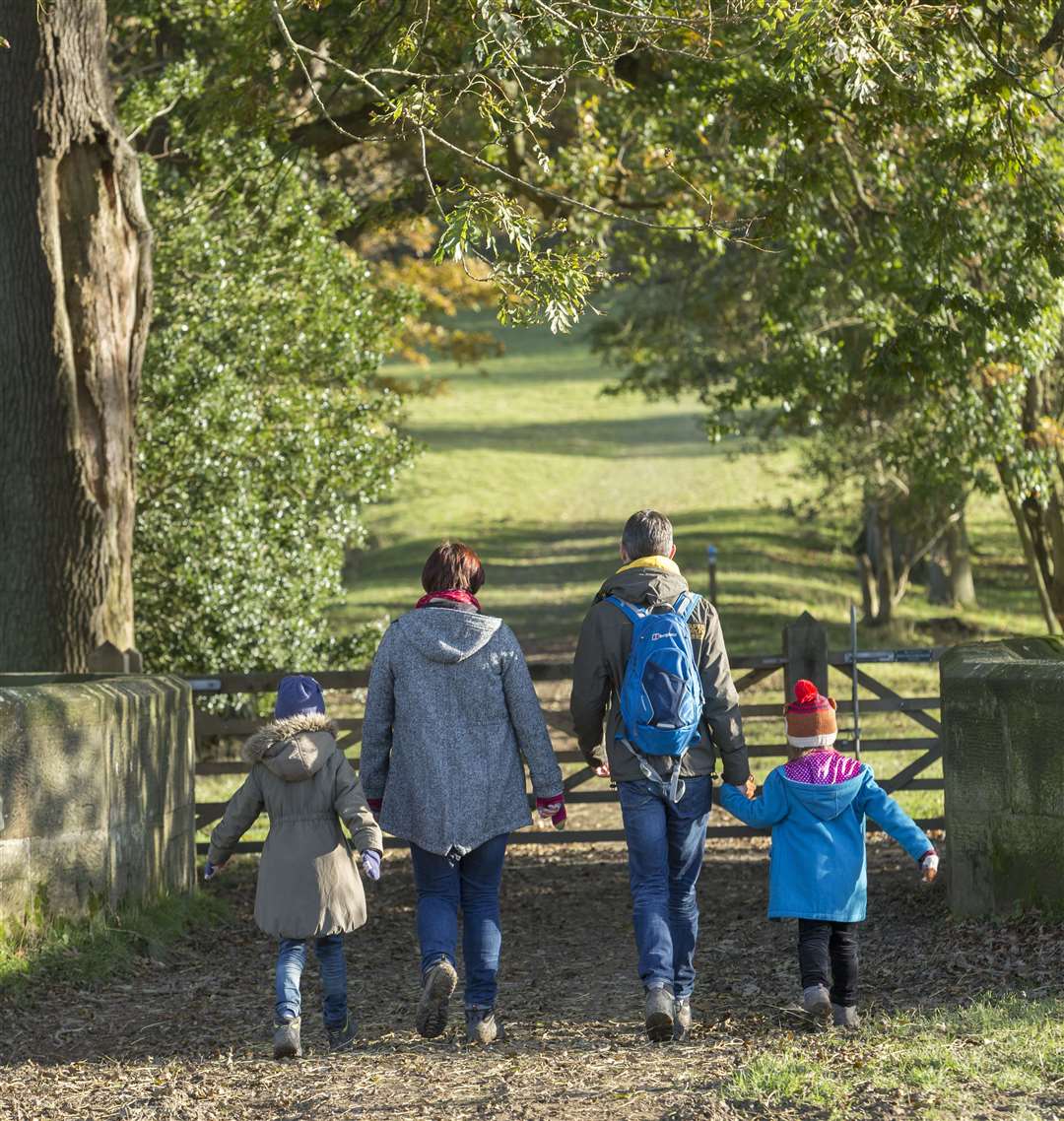 A family walking in the autumn at Scotney Castle Picture: National Trust Images/ John Millar