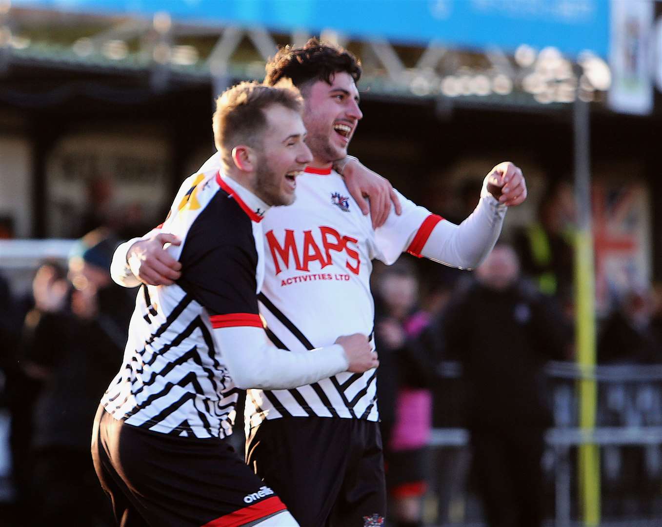 Jack Penny celebrates with a Deal team-mate having - quite incredibly - netted twice direct from corners in their 2-0 win over Bearsted. Picture: Paul Willmott