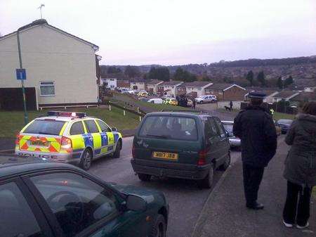 The scene in Defiant Close where officers have surrounded a house following reports of a firearms incident. Picture by Matt Bray