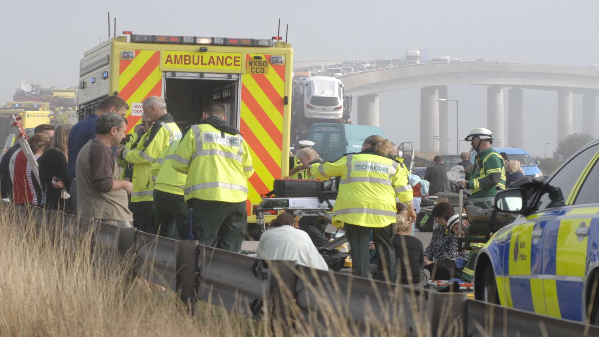 An injured motorist is treated by paramedics. Picture: Chris Davey