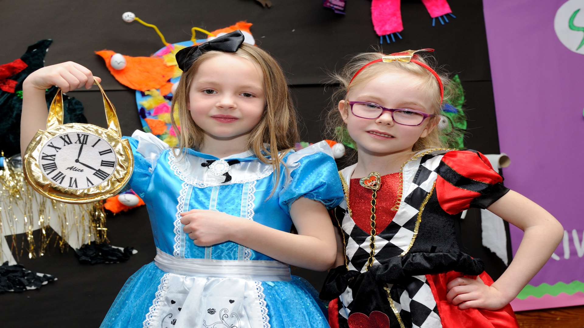 Georgina and Lily in Wonderland attire at Riverview Infant School.