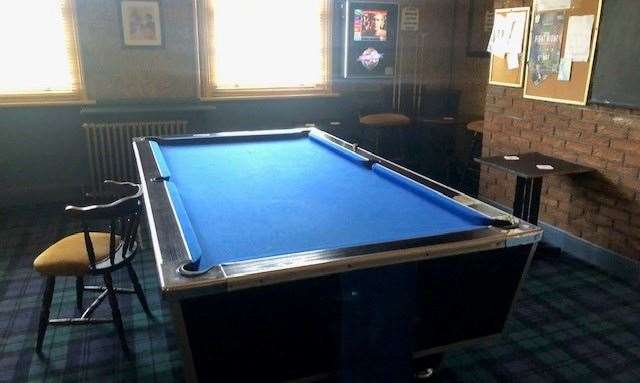Like many things in The Gamecock, the pool table was matched with the very blue theme