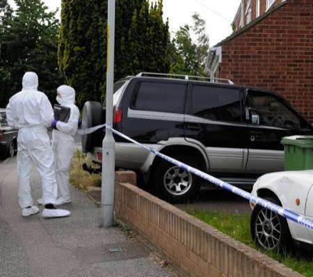 Police Forensic Investigators at the scene of a murder on Oak Road, Murston on Saturday, June 6.