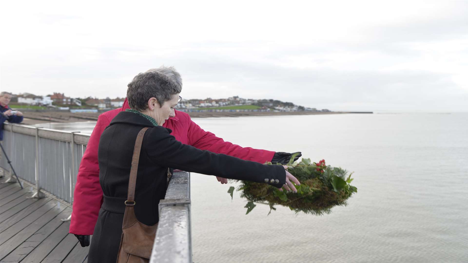 Jane Priston and Johnson’s niece Judith Chilvers drop a wreath to mark the anniversary