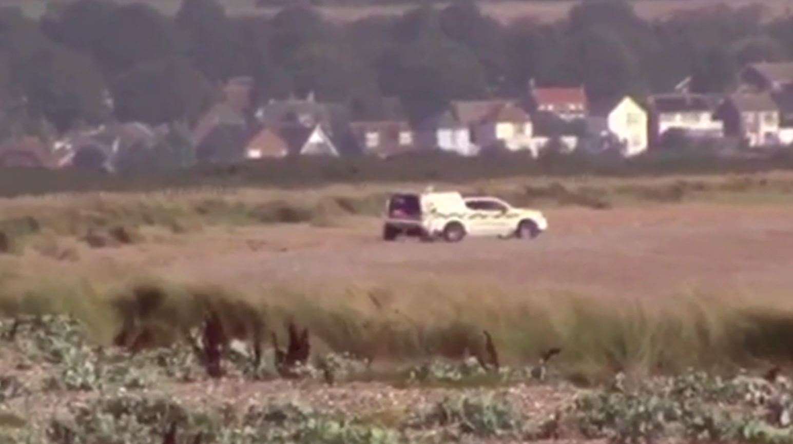 Footage shows a bomb disposal unit vehicle parked on the beach. Picture from video by Chris Johnson