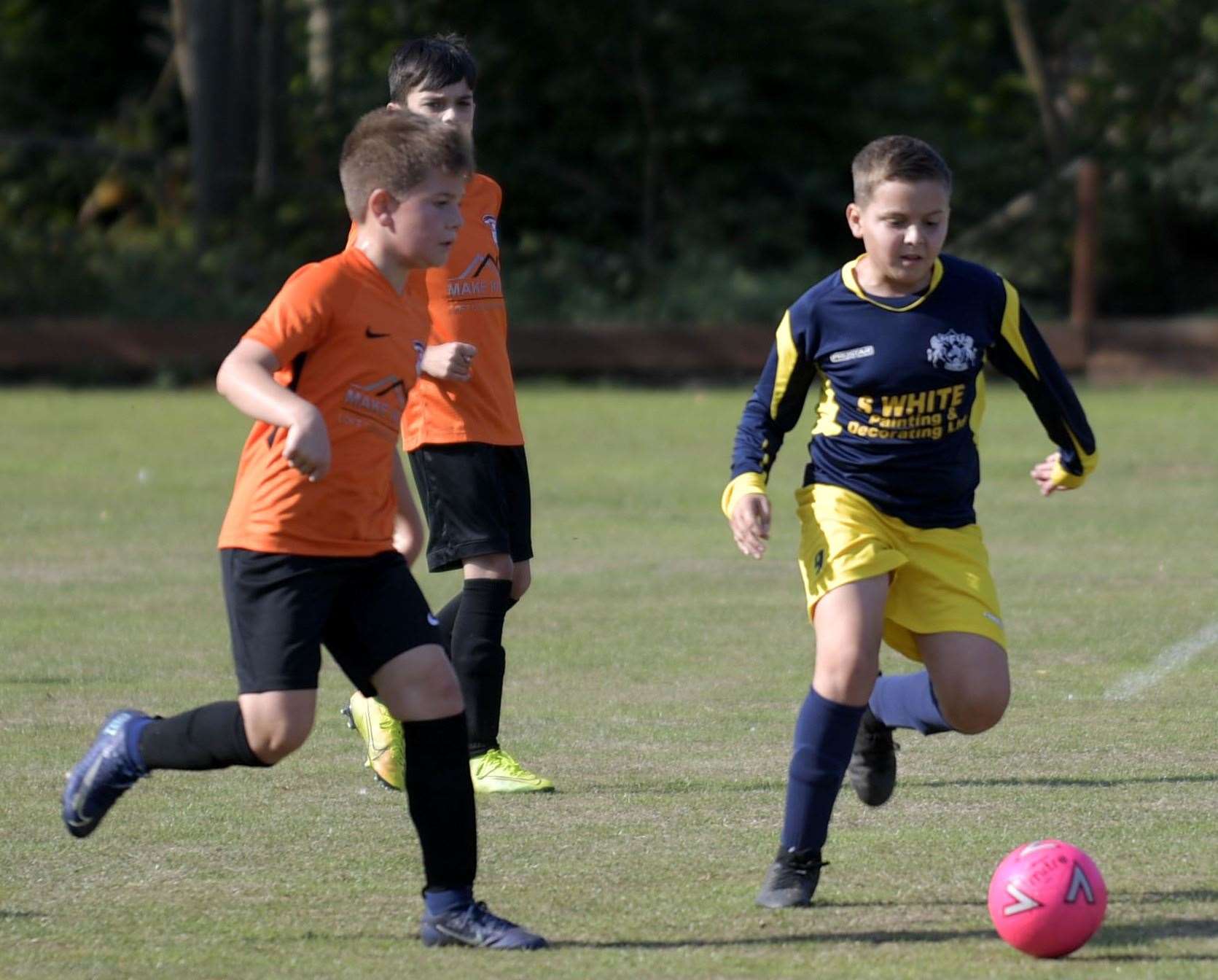 Milton & Fulston United under-10s (blue) give chase against Lordswood Youth under-10s. Picture: Barry Goodwin (42223659)