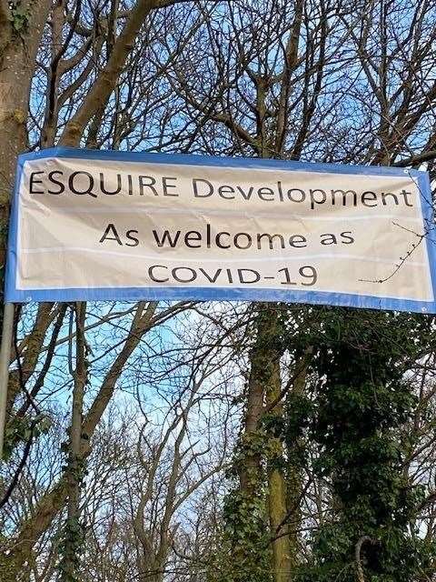 Signs protesting to Keep Upnor Green as Esquire Development plans to build