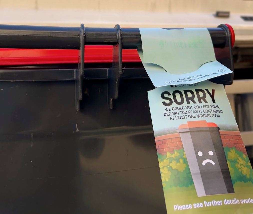 If refuse collectors find contamination in a recycling bin, they will not empty the bin but leave some information behind in the form of a hanger to explain why. Picture: Canterbury City Council