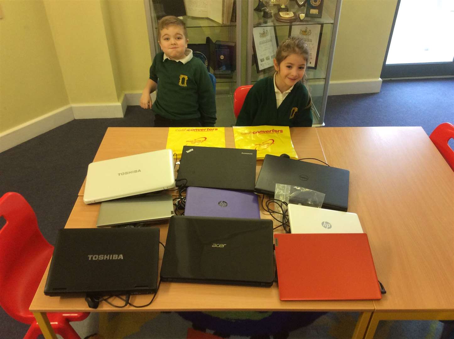 From left: Westgate Primary School pupils, Spencer Croft and Elif Bassoy with laptops donated from Cash Converters