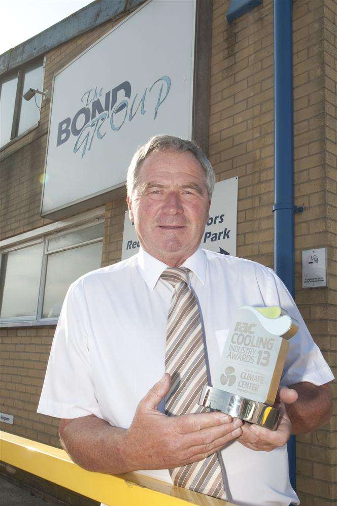 The Bond Group managing director Chris Woollett with his award