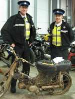 PCSO Mark Ibbott and PCSO Peter Gardner with the seized bike