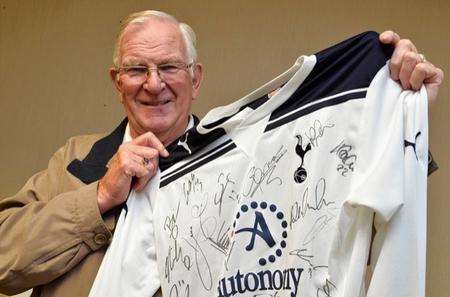 George Bull with the Spurs shirt autographed by the first team