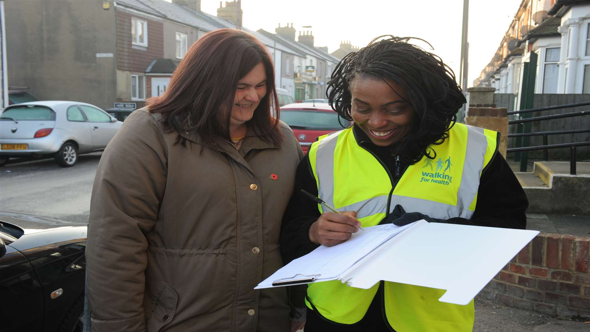 Maureen Ejimofor (right) shows Maria Roberts the route