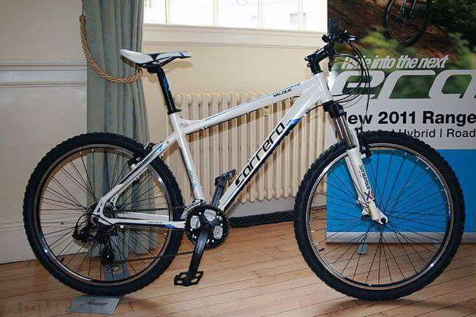 A boy was assaulted by a group of men who demanded he hand over his bike, a white and black Carrera mountain bike worth £300, similar to this one.