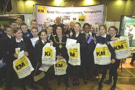 Maidstone's mayor, Cllr Pat Marshall. centre, with some of the students at the KM Group stand