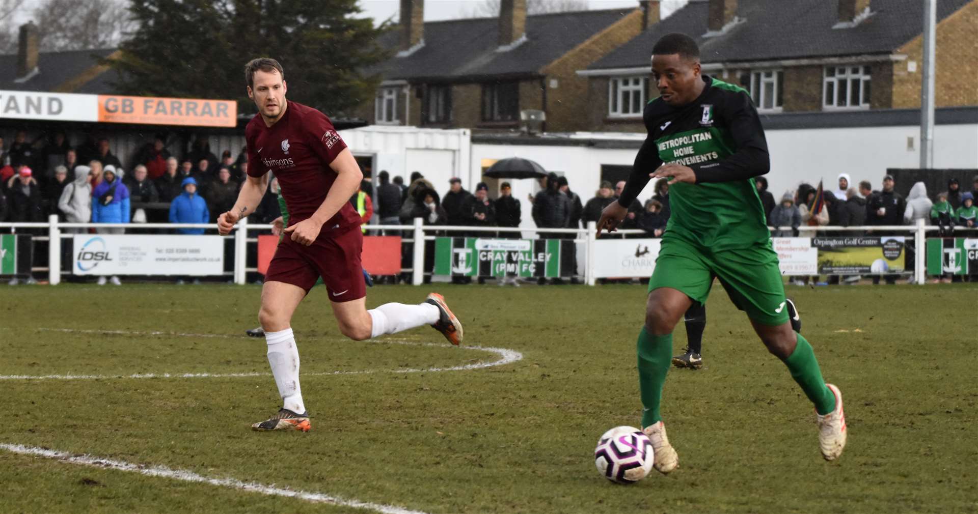 Cray Valley striker Kevin Lisbie tracked by Phil Starkey Picture: Alan Coomes