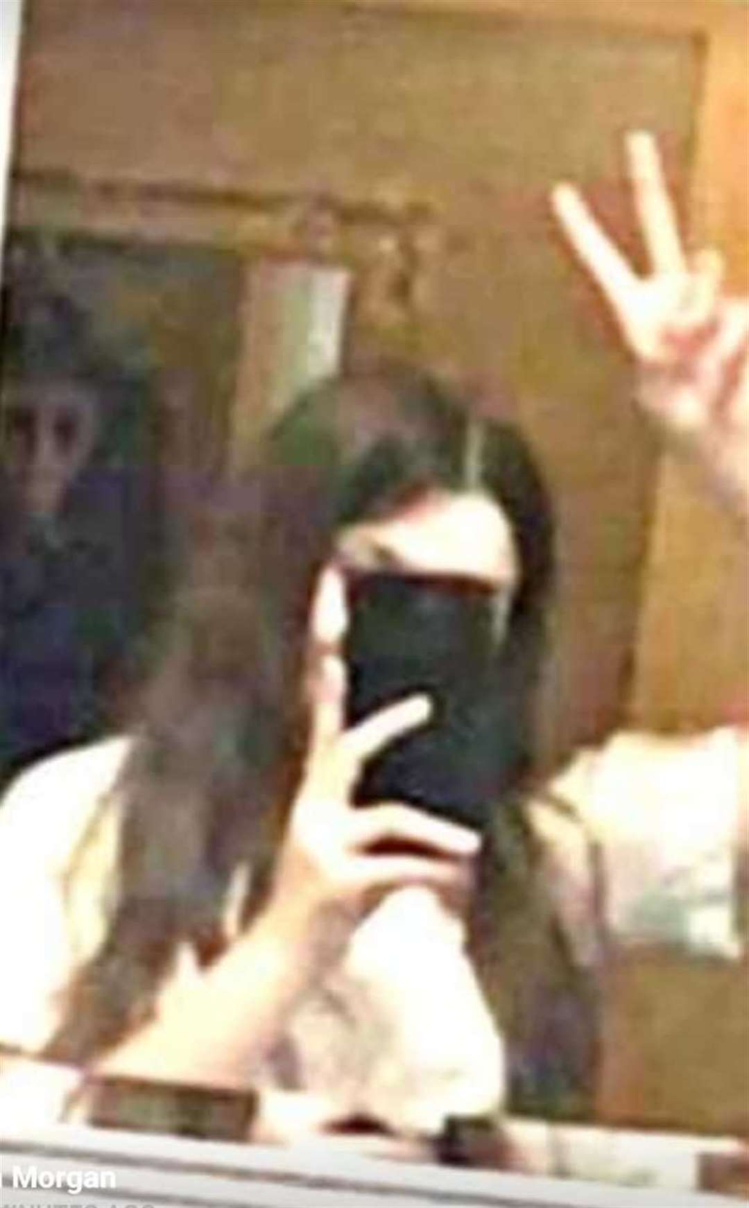 Ghost on the left hand side of the photo in a screenshot while they were having a facetime call