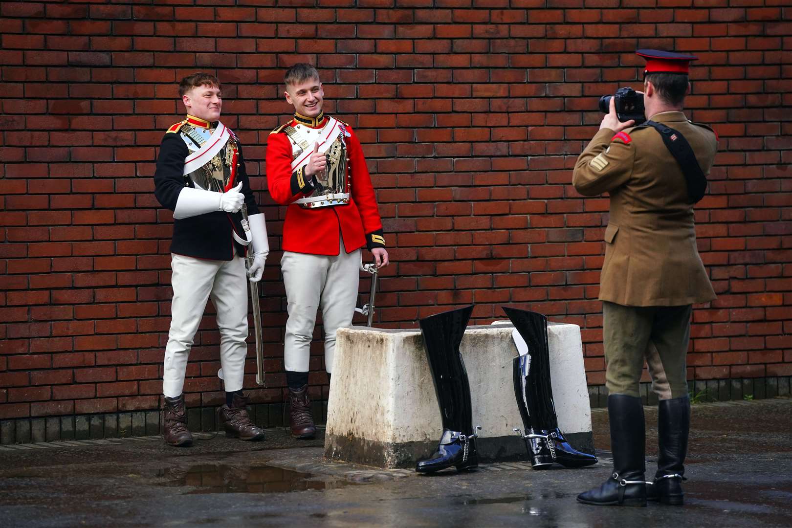 Two members of the Life Guards and the Blues and Royals pose together (Victoria Jones/PA)