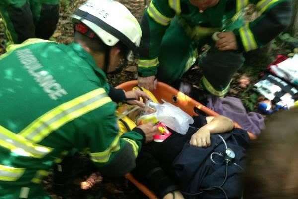 Medics lift Jacky Gray onto the waiting air ambulance