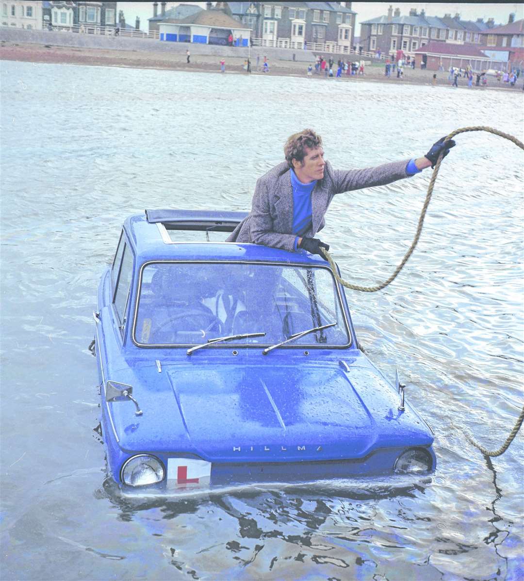 Michael Crawford gets a tow back to dry land after filming the episode Learning To Drive on the seafront at Sheerness for the finale of the 1975 Christmas special of Some Mothers Do 'Ave 'Em. Picture: Barry Hollis