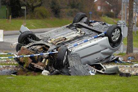 The car was left on its roof on the Conningbrook roundabout in Kennington