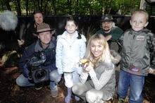 Sturry School pupils Bobbie Scargill and Charlie Jordan with TV presenter Michaela Strachan watched by Wildwood's Martin Nichols are filmed by Luke Gallie and Jonathan Frisby at Wildwood on Friday