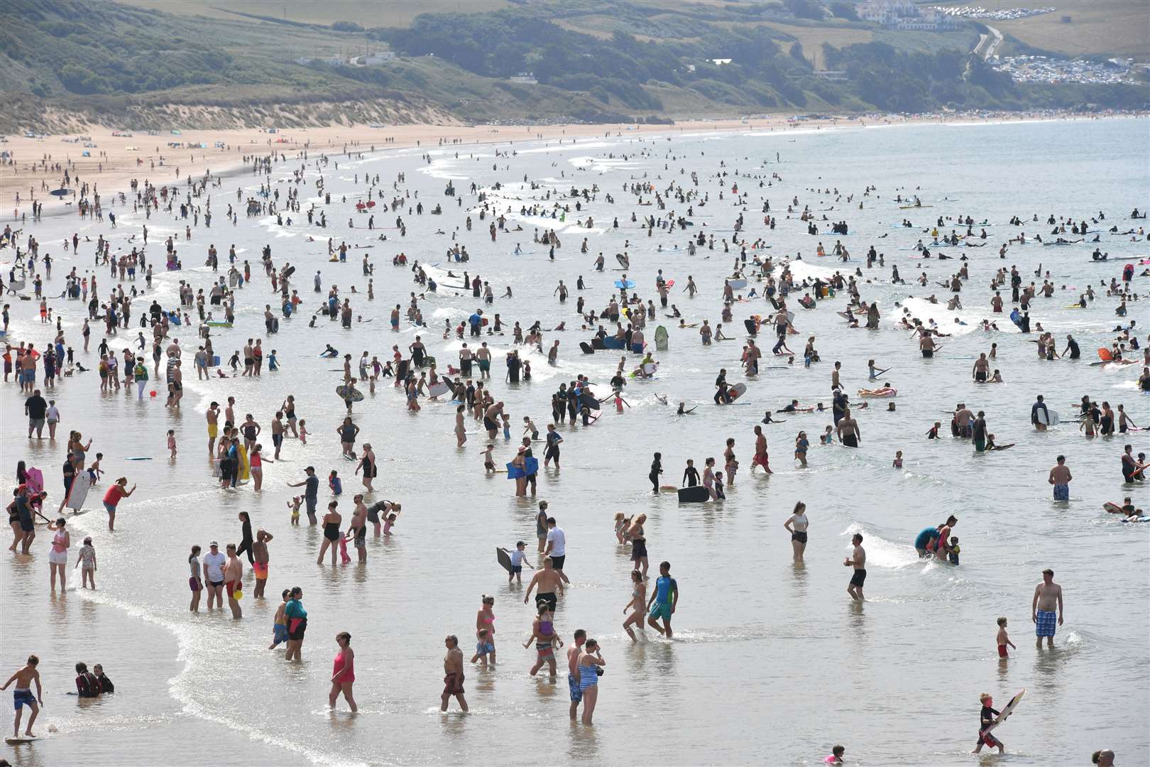 People in the sea at Woolacombe Beach in North Devon (Ben Birchall/PA)
