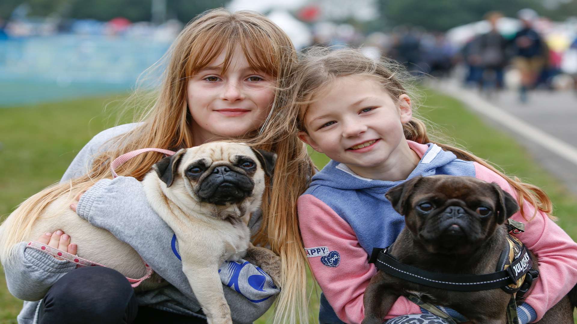 Grace Gordon and Maddy Cawston with pugs Flow and Marley at last year's show. Picture: Matthew Walker