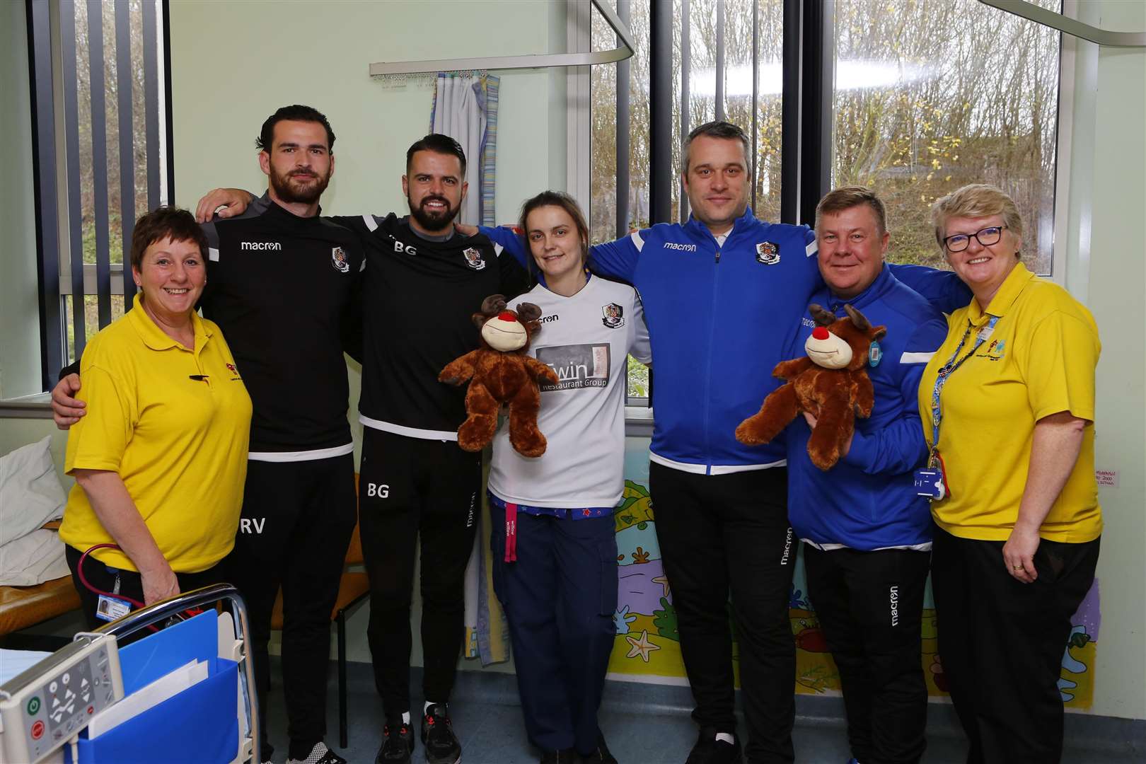 Play specialist Sharon Samuels, Ronnie Vint, Ben Greenhalgh, ward sister Jade Gavin, Adam Flanagan, Terry Groom and play specialist Donna Day. Picture: Andy Jones