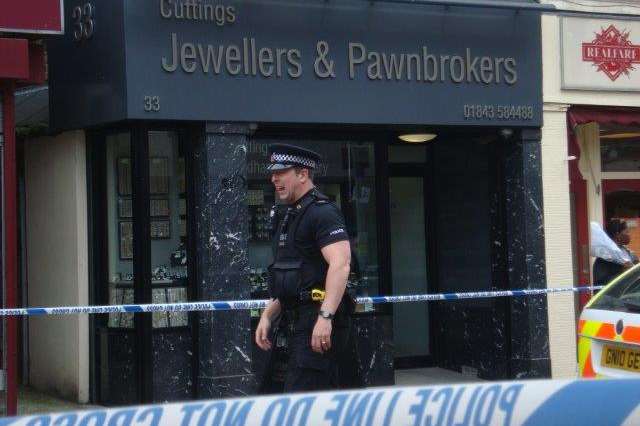Police tape around the shop. Picture: Fred Brand