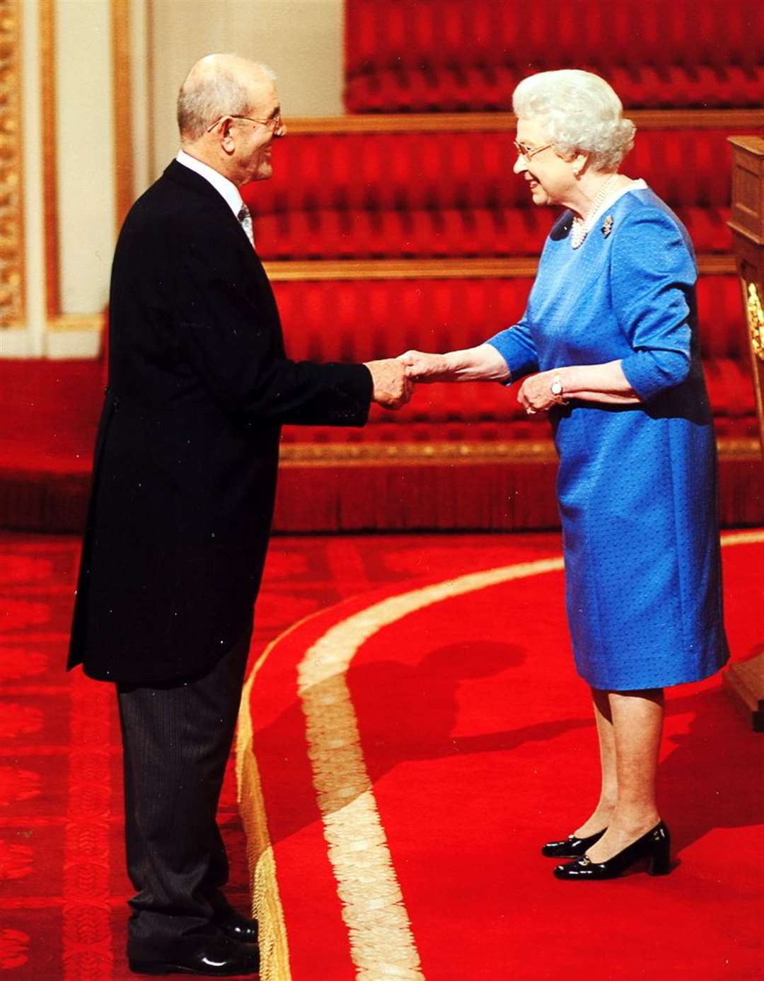Dick Laslett receives his MBE from Her Majesty The Queen at Buckingham Palace.