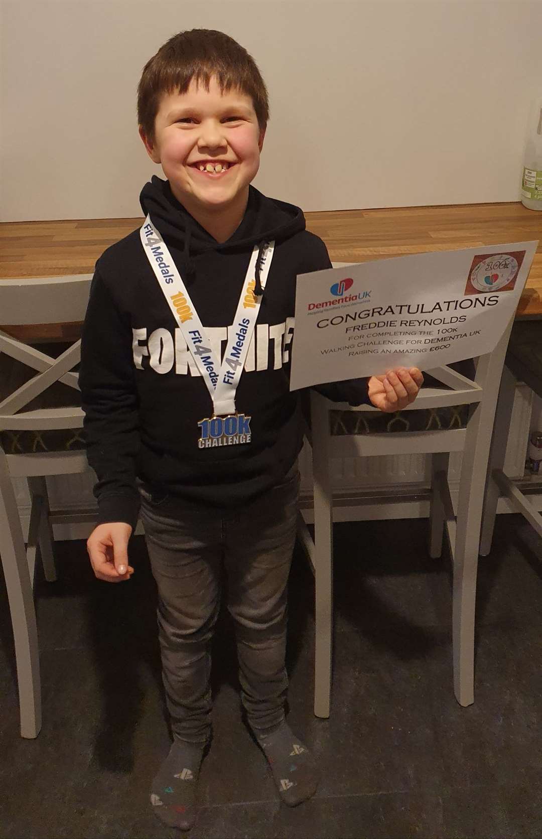 Freddie with his certificate and medal