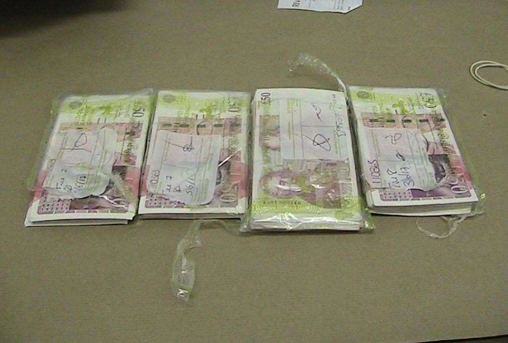 Images of cash seized from Hoger’s vehicle after he was arrested for money laundering. (14246566)