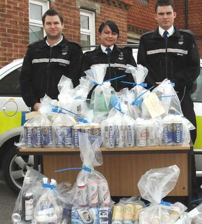 The Herne Bay neighbourhood police team with the bags of seized alcohol. Pictures courtesy Kent Police