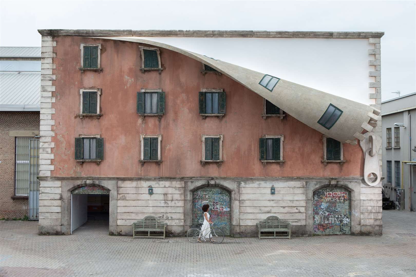 A seemingly historic building in Milan was unzipped by Alex Chinneck. Picture: Marc Wilmot