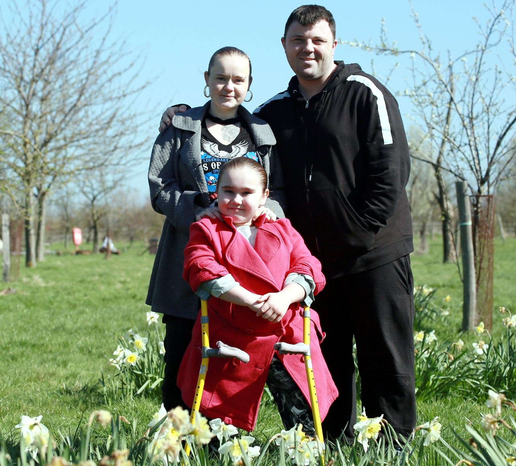 Angel Farley with her parents Holly and Rob Picture: Phil Lee