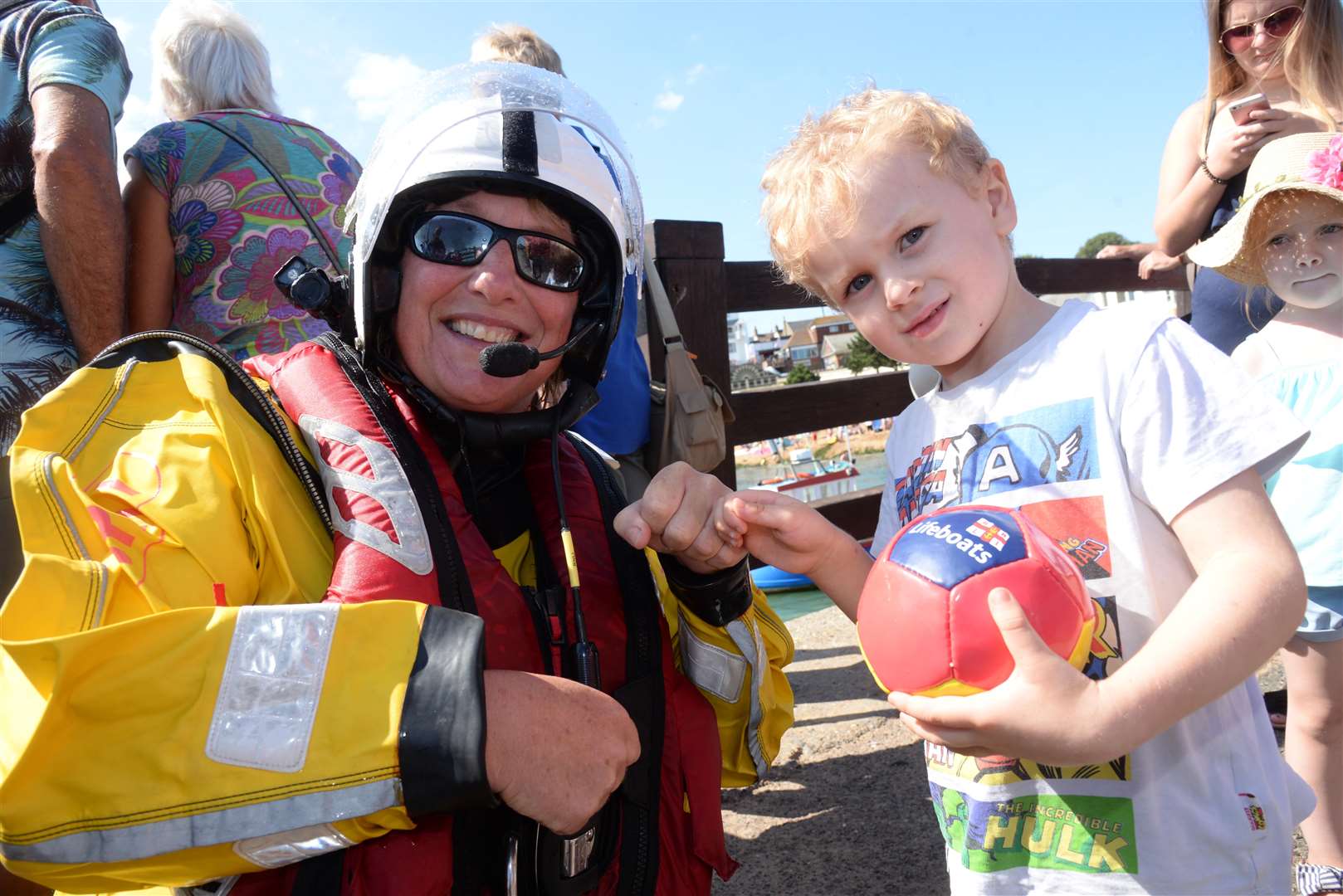 Dominic Ellis, four shows off his lifeboat ball to Ramsgate crewmember Caroline Hoyal