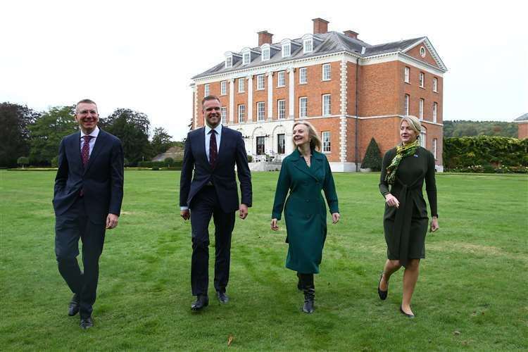 Liz Truss walks with the foreign ministers of three Baltic states through the grounds of Chevening. Picture: Hollie Adams/PA