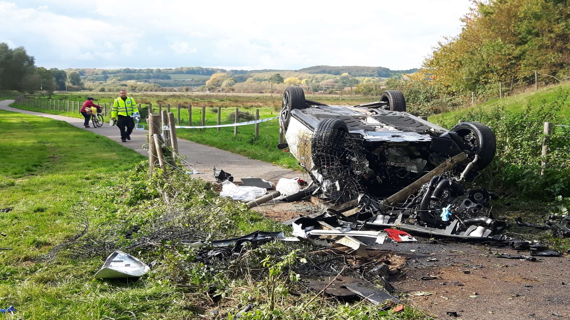 The wrecked car on the cycle path