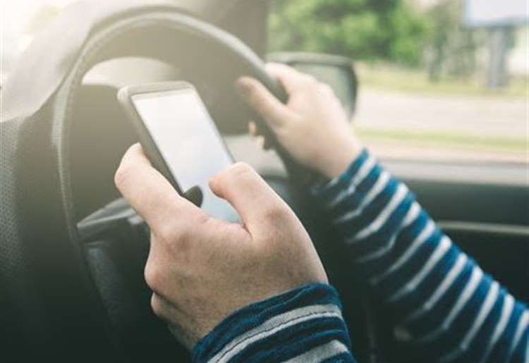 The new law prevents drivers picking up their phone for 'virtually any reason'