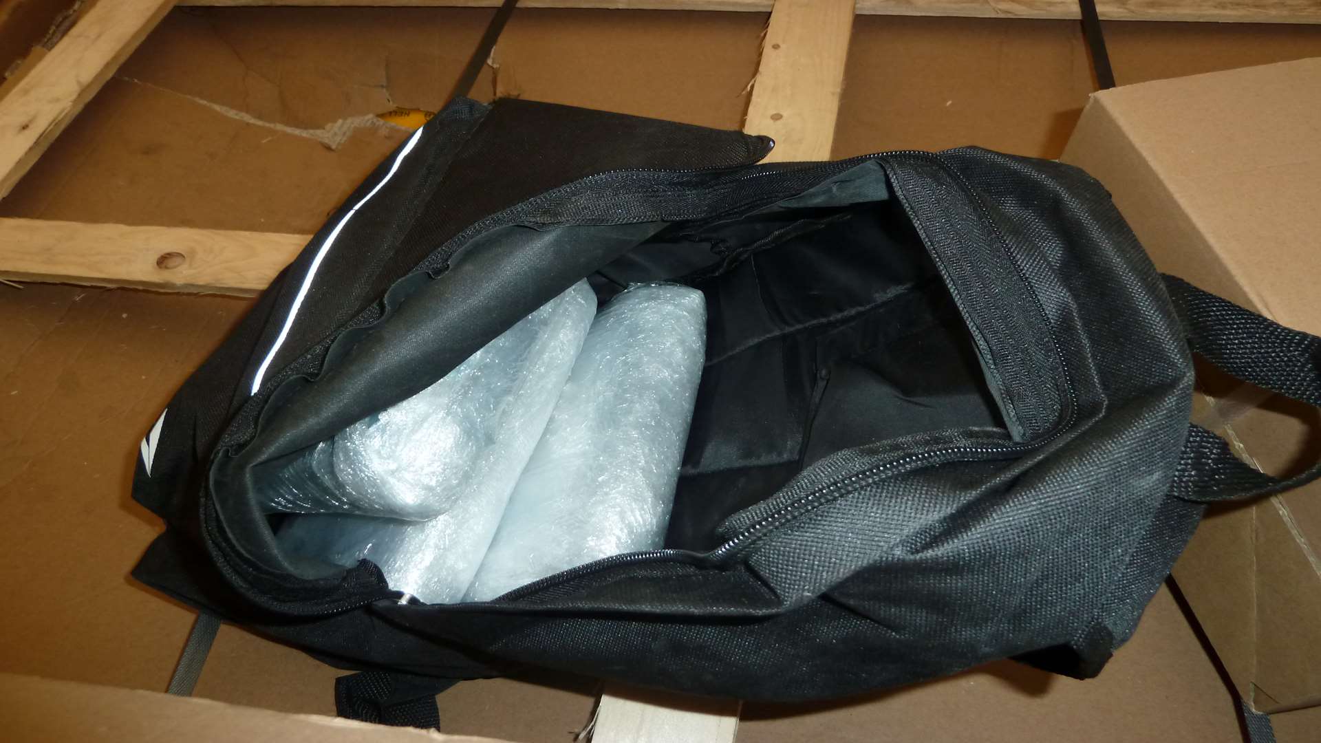 The rucksack containing three cling filmed-wrapped packages of cocaine