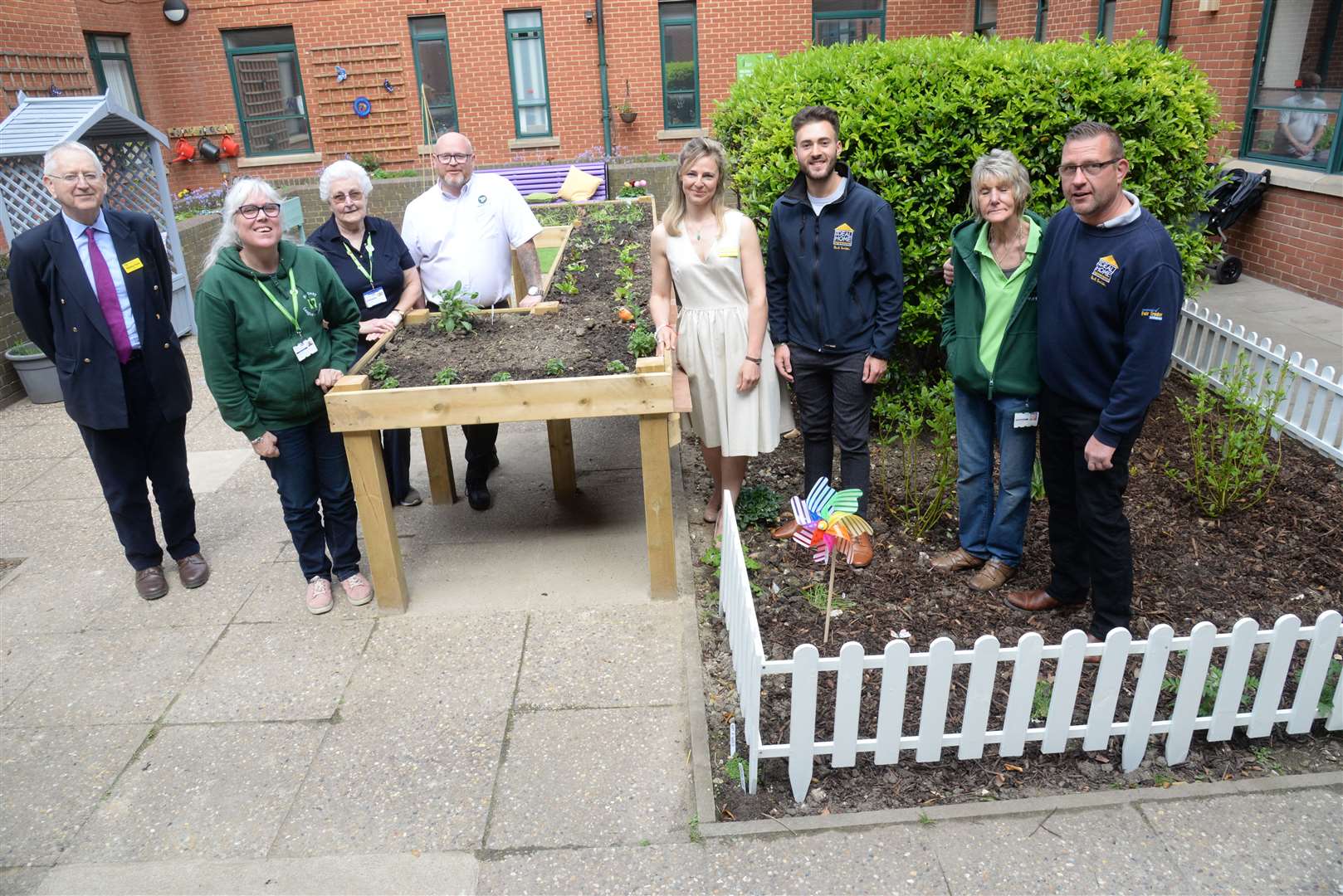 Sponsors and representatives of sponsors look around the dementia garden at the Medway Maritime Hospital after its opening on Wednesday. Picture: Chris Davey. (9488699)