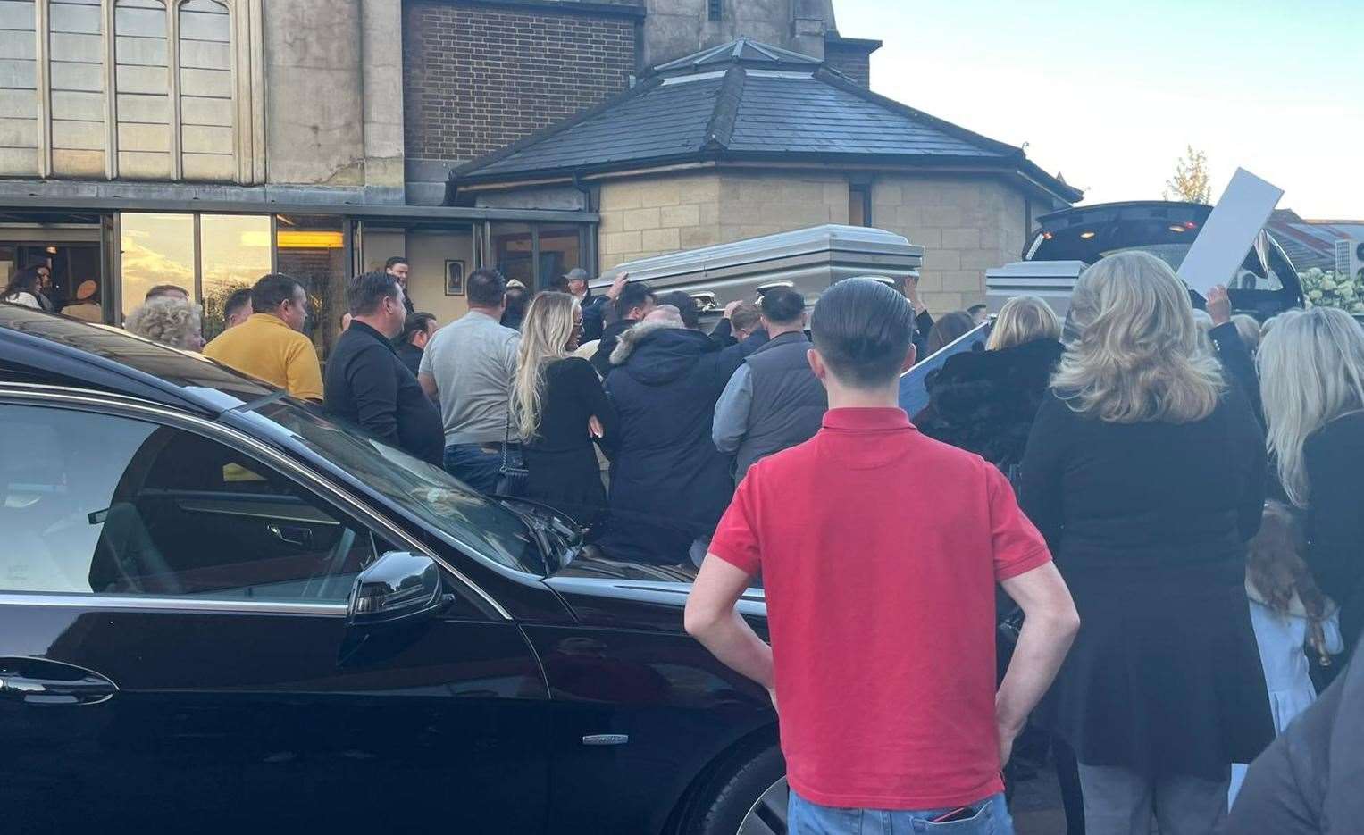 Mourners outside St Francis Church, in Maidstone, as the coffins of four men who died in a crash on Sunday, October 10, are carried in