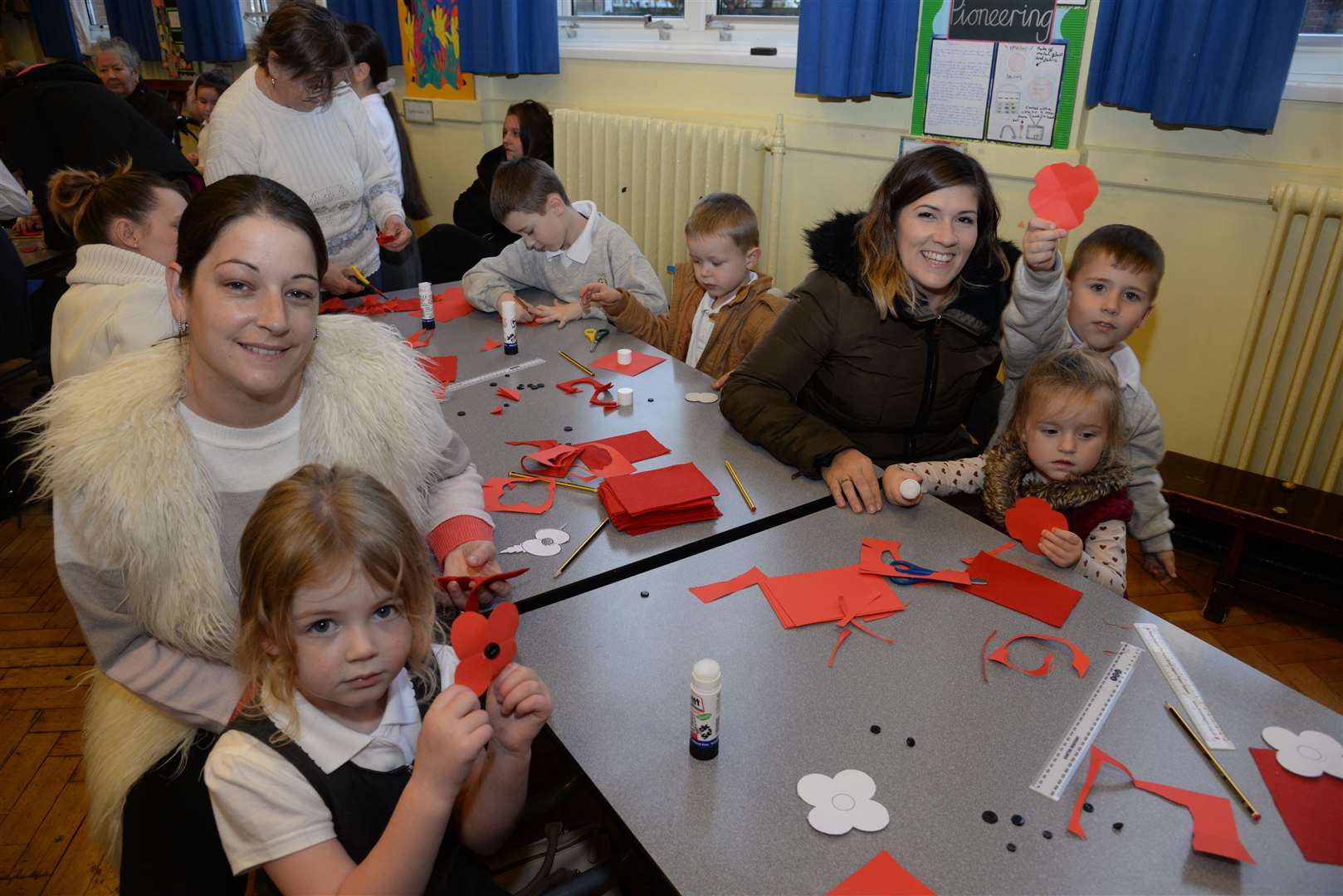 Children and parents at a Remembrance poppy making session at Oaks Primary Academy in Maidstone. Picture: Chris Davey